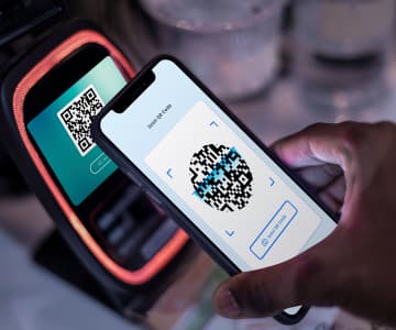 A phone scans the qr code