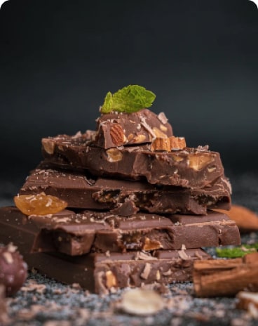 Assorted chocolate bars with dried fruits and mint