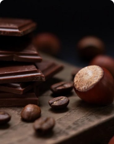 chocolate pieces with coffee beans and hazelnut